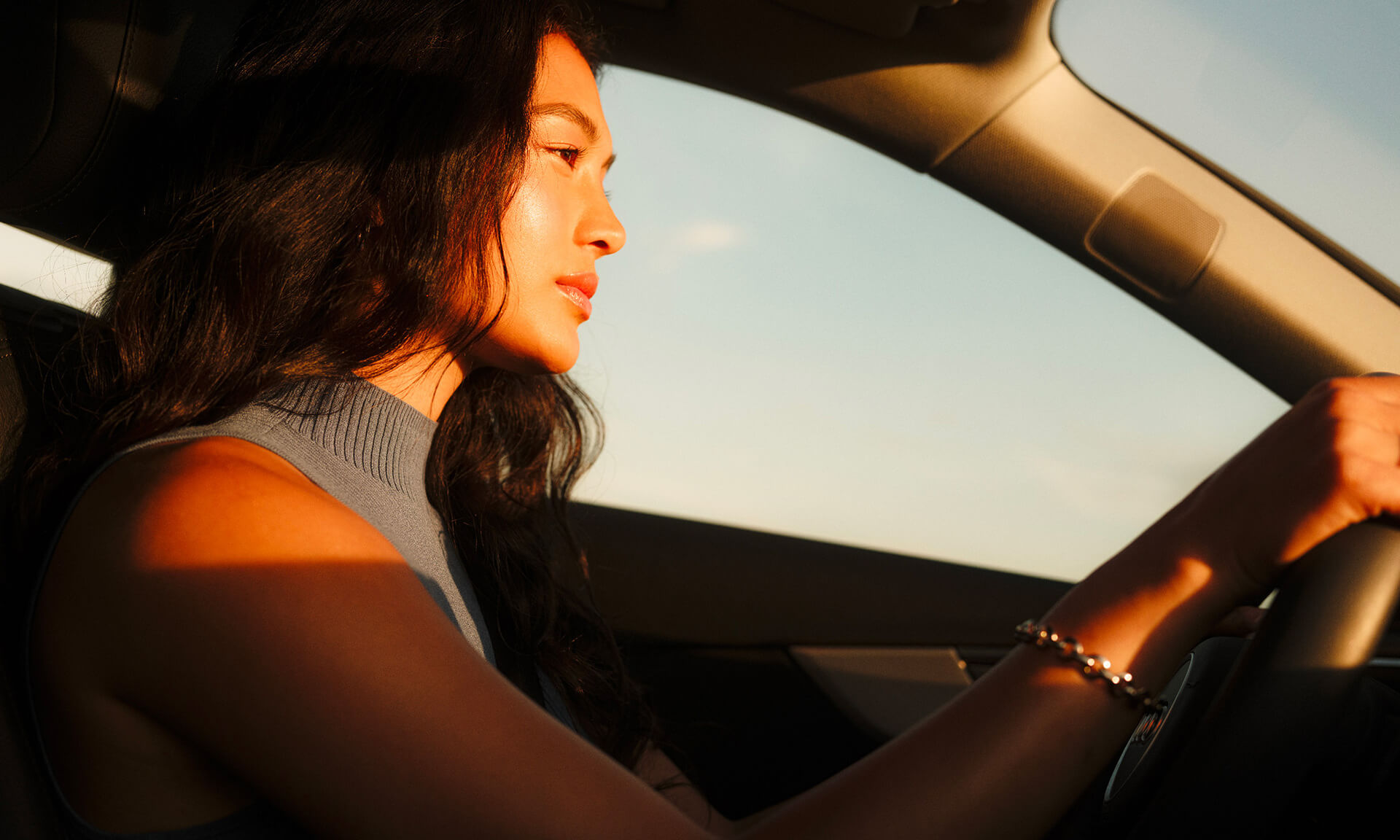 Close-up of a person's eyes bathed in blue light with a streak of yellow over one eye